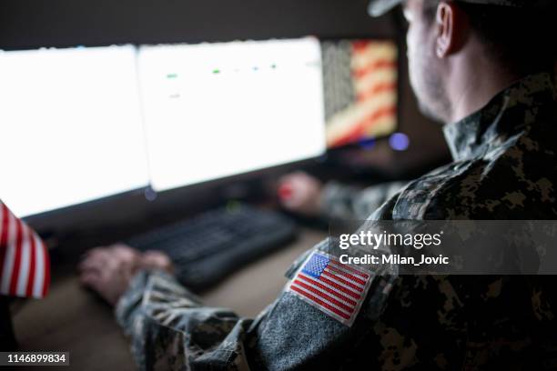 american soldier in headquarter control center - us military stock pictures, royalty-free photos & images
