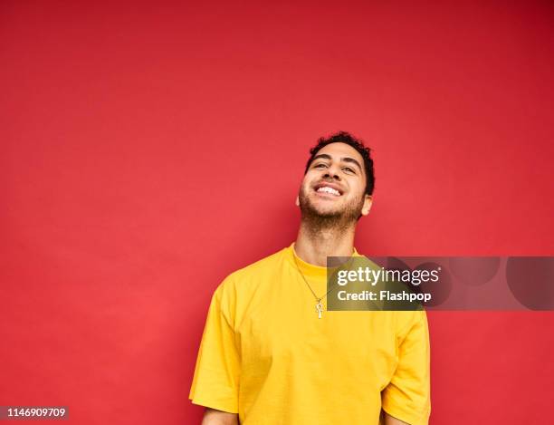 colourful studio portrait of a young man - gay person color background stock pictures, royalty-free photos & images