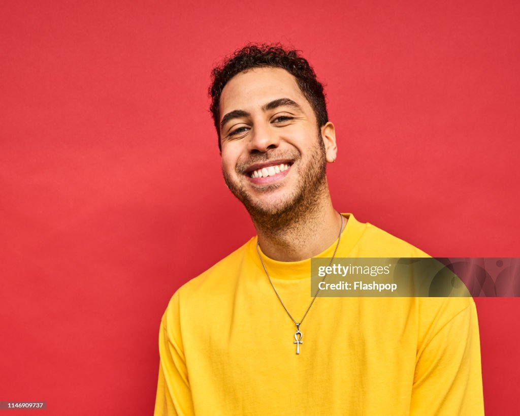 Colourful studio portrait of a young man