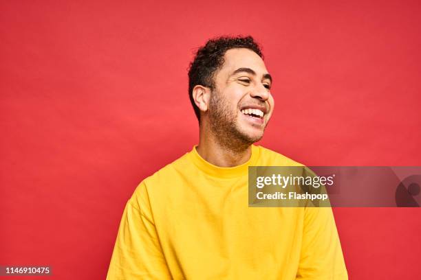 colourful studio portrait of a young man - gay person color background stock pictures, royalty-free photos & images