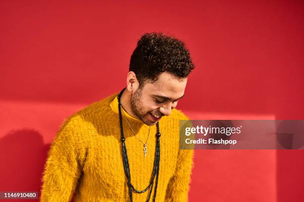 colourful studio portrait of a young man - one man only stock pictures, royalty-free photos & images