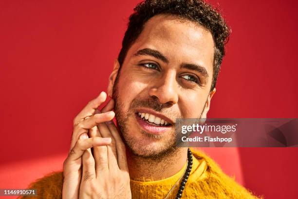 colourful studio portrait of a young man - one man only stock pictures, royalty-free photos & images