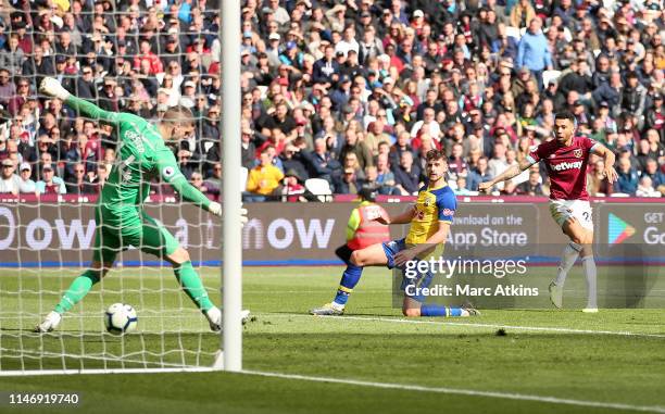 Ryan Fredericks of West Ham United scores his team's third goal during the Premier League match between West Ham United and Southampton FC at London...