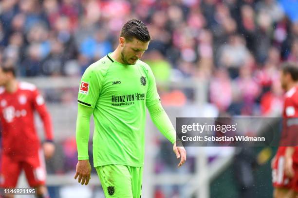 Kevin Wimmer of Hannover 96 looks dejected after the Bundesliga match between FC Bayern Muenchen and Hannover 96 at Allianz Arena on May 04, 2019 in...