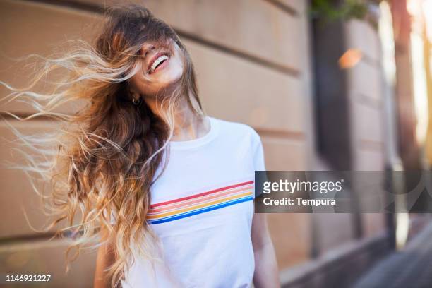 young woman influencer posing for social media. - long hair stock pictures, royalty-free photos & images
