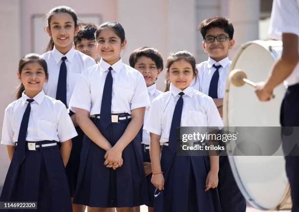 group of students drumming in school assembly - assembly room stock pictures, royalty-free photos & images