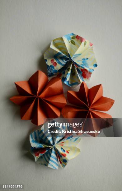 origami flowers on white background - origami flower stock pictures, royalty-free photos & images
