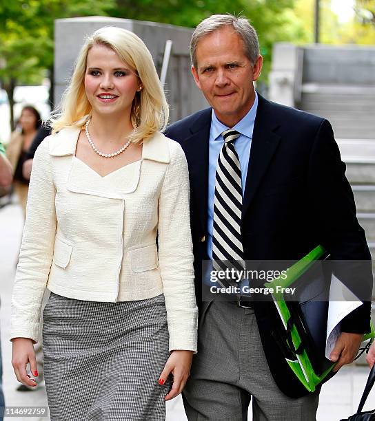 Elizabeth Smart and her father Ed Smart walk out of federal court after the sentencing of Elizabeths kidnapper Brian David Mitchell May 25, 2011 in...