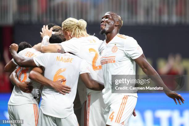 Florentin Pogba along with other members of Atlanta United celebrate a goal scored by Josef Martinez of Atlanta United during the second half of the...