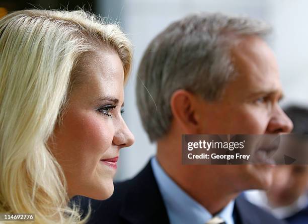 Elizabeth Smart listens to her father Ed Smart talk to the press outside of federal court after the sentencing of Elizabeths kidnapper Brian David...