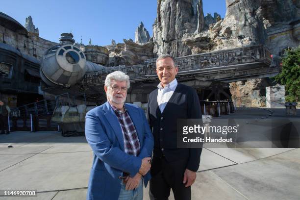 In this handout photo provided by Disneyland Resort, Walt Disney Company Chairman and CEO Bob Iger , and Star Wars creator George Lucas stand in...