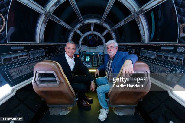 In this handout photo provided by Disneyland Resort, Walt Disney Company Chairman and CEO Bob Iger , and Star Wars creator George Lucas pose inside...