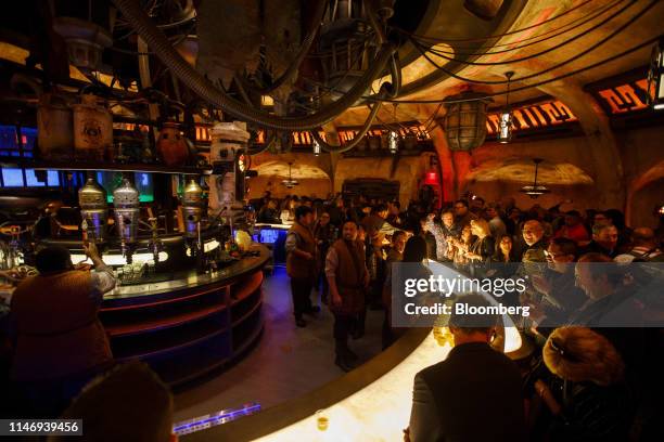 Drinks are served at the bar at Oga's Cantina following the unveiling of Star Wars: Galaxy's Edge at Walt Disney Co.'s Disneyland theme park in...