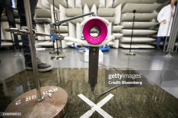 Dyson supersonic hairdryer is held in a clamp in the semi anechoic acoustics chamber at the Dyson Group Plc campus in Malmesbury, U.K., on Wednesday,...