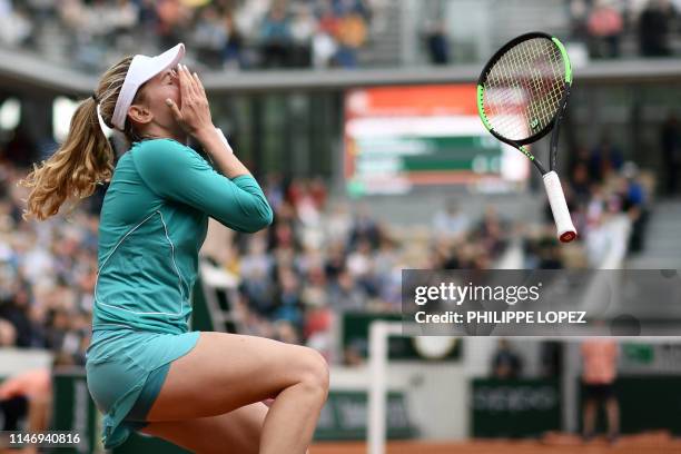 Russia's Ekaterina Alexandrova celebrates after winning against Australia's Samantha Stosur during their women's singles second round match on day...