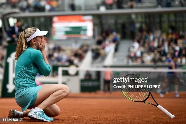 Russia's Ekaterina Alexandrova celebrates after winning against Australia's Samantha Stosur during their women's singles second round match on day...