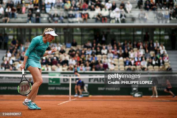 Russia's Ekaterina Alexandrova celebrates after winning against Australia's Samantha Stosur during their women's singles second round match on day...