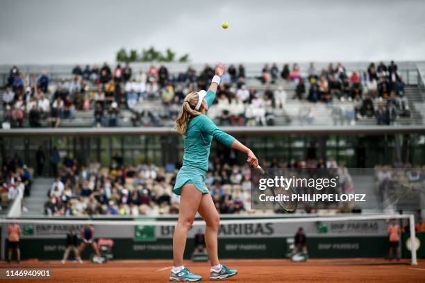 Russia's Ekaterina Alexandrova serves the ball to Australia's Samantha Stosur during their women's singles second round match on day five of The...