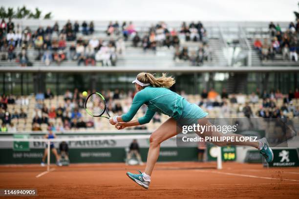 Russia's Ekaterina Alexandrova returns the ball to Australia's Samantha Stosur during their women's singles second round match on day five of The...