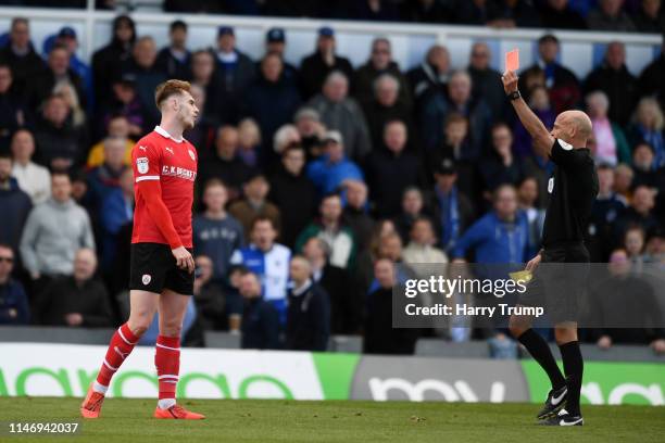 Liam Lindsay of Barnsley is shown a second yellow and therefore a red card by referee Darren Drysdale during the Sky Bet League One match between...