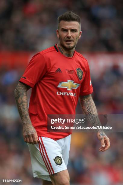 David Beckham of Man Utd looks on during the Treble Reunion friendly match between the Manchester United '99 Legends and FC Bayern Legends at Old...