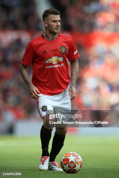 David Beckham of Man Utd in action during the Treble Reunion friendly match between the Manchester United '99 Legends and FC Bayern Legends at Old...