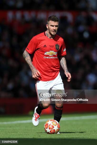 David Beckham of Man Utd in action during the Treble Reunion friendly match between the Manchester United '99 Legends and FC Bayern Legends at Old...