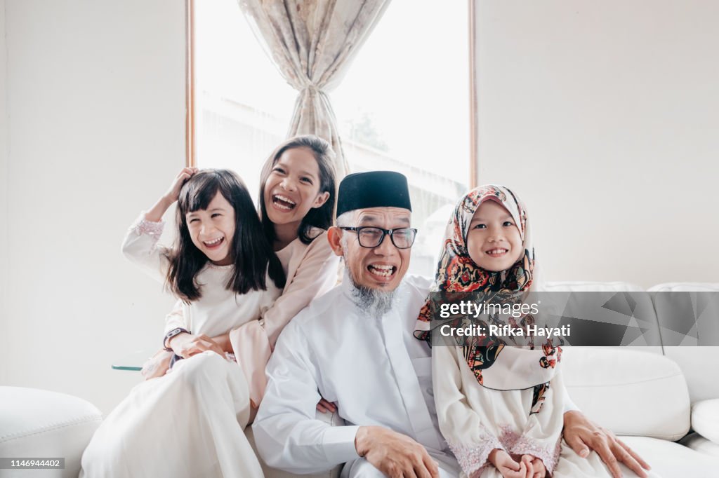 Grandfather with Grandchild during Eid Mubarak