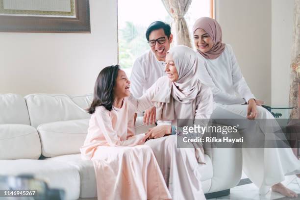 hari raya celebration with family - islam stock pictures, royalty-free photos & images