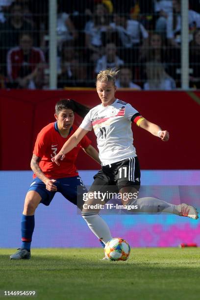 Carla Guerrero of Chile and Alexandra Popp of Germany battle for the ball during the international friendly match between Germany Women and Chile...