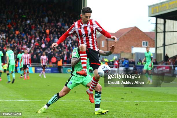 Tom Pett of Lincoln City controls the ball during the Sky Bet League Two match between Lincoln City and Colchester United at Sincil Bank Stadium on...