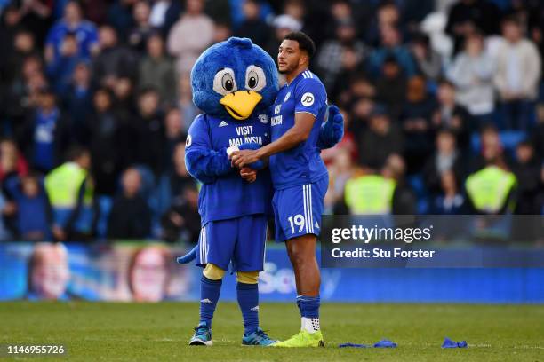 Bartley Bluebird, Cardiff City Mascot and Nathaniel Mendez-Laing of Cardiff City look dejected as their team are relegated following the result in...