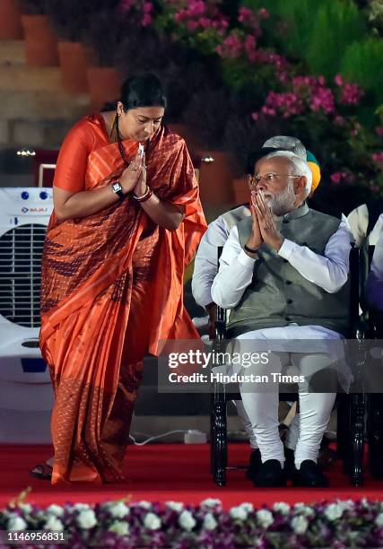 Amethi's MP-elect Smriti Irani greets Prime Minister Narendra Modi before taking oath during the swearing-in ceremony at the forecourt of Rashtrapati...