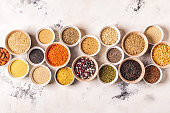 Set of different superfoods- whole grains, beans and legumes, seeds and nuts