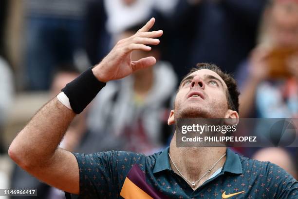 Argentina's Juan Martin del Potro celebrates after winning against Japan's Yoshihito Nishioka during their men's singles second round match on day...