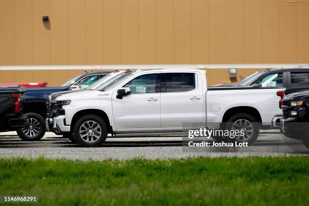 Chevrolet pickup trucks sit in a parking lot outside the GM Fort Wayne Assembly Plant on May 30, 2019 in Roanoke, Indiana. General Motors Chairman...