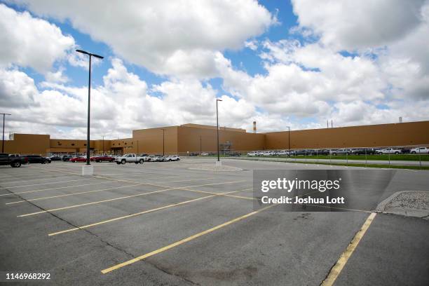 And Chevrolet pickup trucks sit in a parking lot outside the GM Fort Wayne Assembly Plant on May 30, 2019 in Roanoke, Indiana. General Motors...