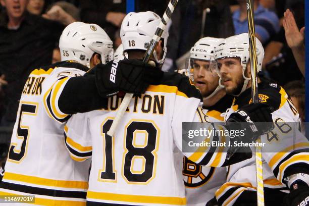 David Krejci of the Boston Bruins celebrates his first period goal with teammates in Game Six of the Eastern Conference Finals against the Tampa Bay...