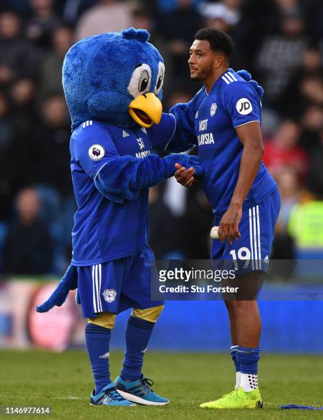 Bartley Bluebird, Cardiff City Mascot and Nathaniel Mendez-Laing of Cardiff City look dejected as their team are relegated following the result in...