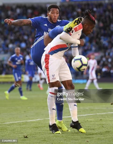 Nathaniel Mendez-Laing of Cardiff City challenges Wilfried Zaha of Palace during the Premier League match between Cardiff City and Crystal Palace at...