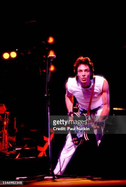 American Rock musician Rick Springfield plays guitar he performs onstage at the Poplar Creek Music Theater, Hoffman Estates, Illinois, August 25,...