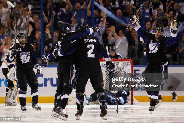 Steven Stamkos of the Tampa Bay Lightning celebrates his third period goal against the Boston Bruins with teammates Simon Gagne, Eric Brewer and...