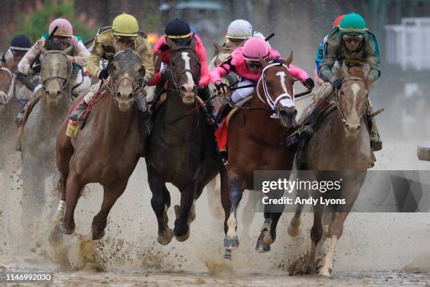 Country House, ridden by jockey Flavien Prat, War of Will, ridden by jockey Tyler Gaffalione , Maximum Security, ridden by jockey Luis Saez and Code...