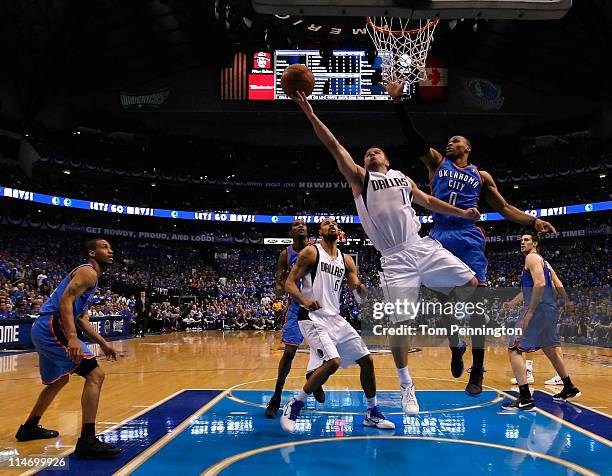 Jose Juan Barea of the Dallas Mavericks goes up for a shot against Russell Westbrook of the Oklahoma City Thunder in the first half in Game Five of...