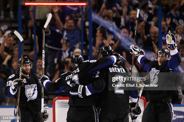 Steven Stamkos of the Tampa Bay Lightning celebrates his third period goal against the Boston Bruins with teammates Simon Gagne, Eric Brewer and...