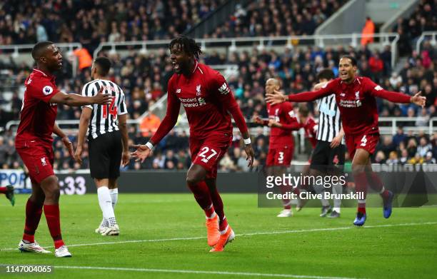 Divock Origi of Liverpool celebrates after scoring his team's third goal during the Premier League match between Newcastle United and Liverpool FC at...