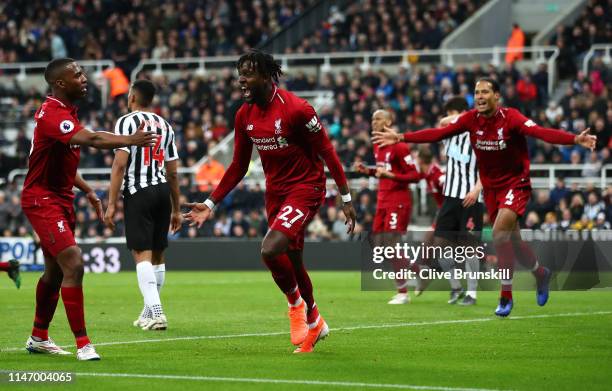 Divock Origi of Liverpool celebrates after scoring his team's third goal during the Premier League match between Newcastle United and Liverpool FC at...