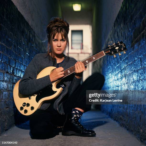Singer-songwriter Juliana Hatfield poses for a portrait with her guitar on May 20, 1993 in New York City, New York.