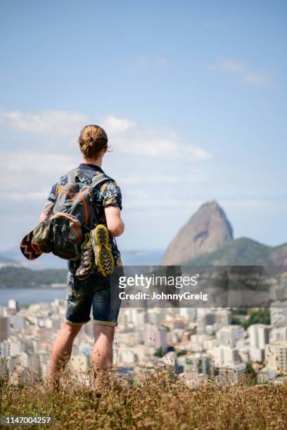 gap year student looking over rio de janeio - tourism in brazil stock pictures, royalty-free photos & images