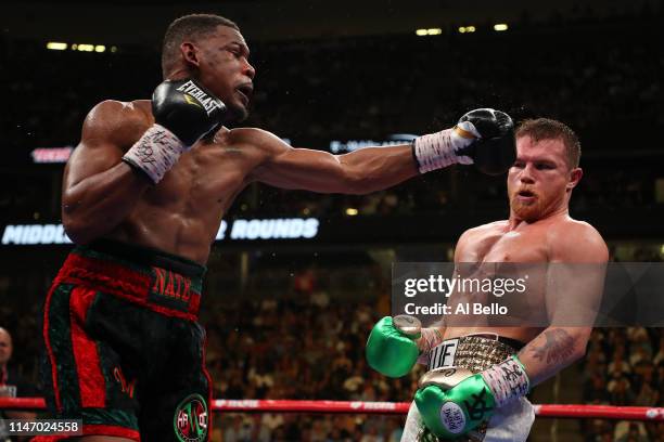 Canelo Alvarez dodges a punch by Daniel Jacobs during their middleweight unification fight at T-Mobile Arena on May 04, 2019 in Las Vegas, Nevada.